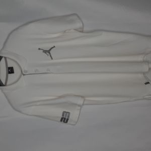 Air Jordan white pole shirt.